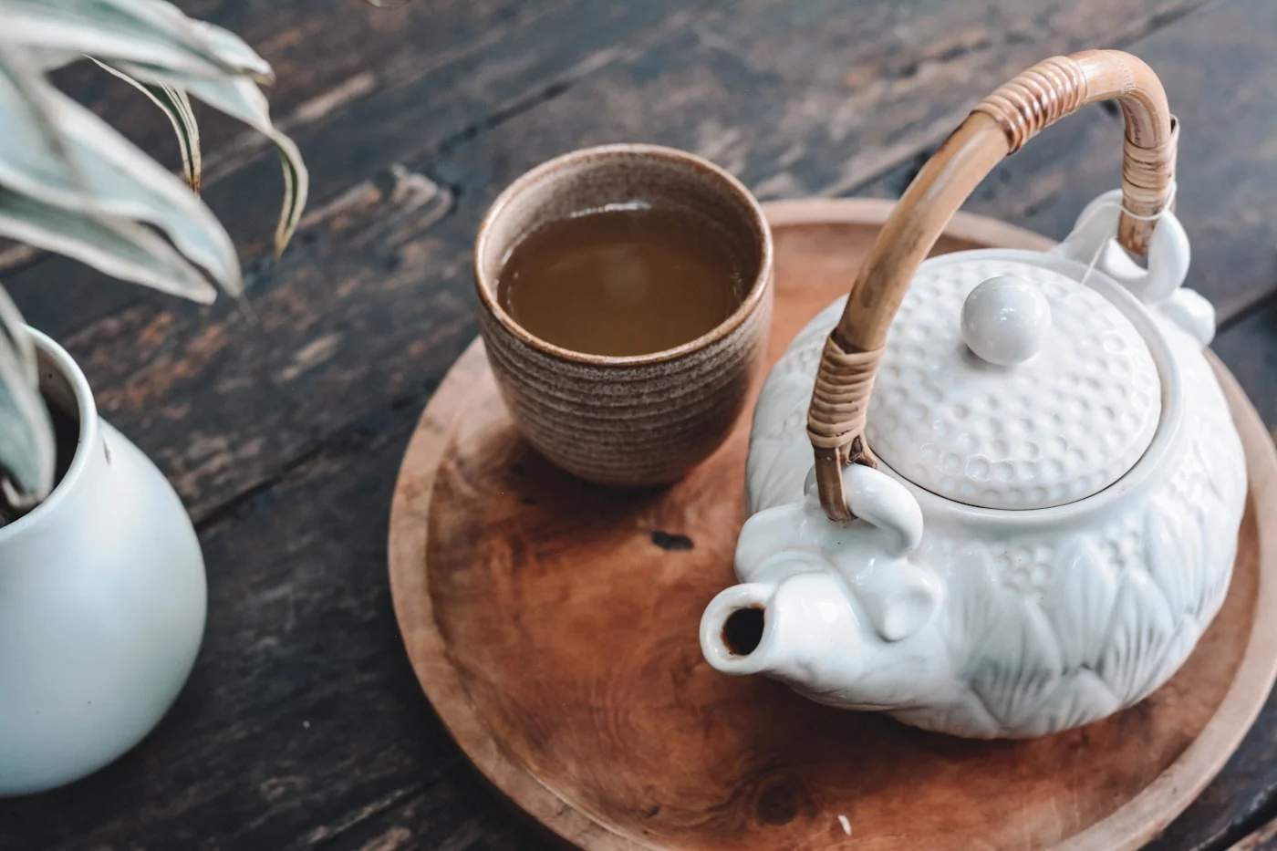 Teapot and cups arranged for a tea tasting